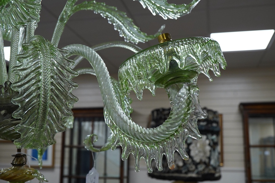 An ornate leaf and floral green glass Murano three branch chandelier, 84cm high.
